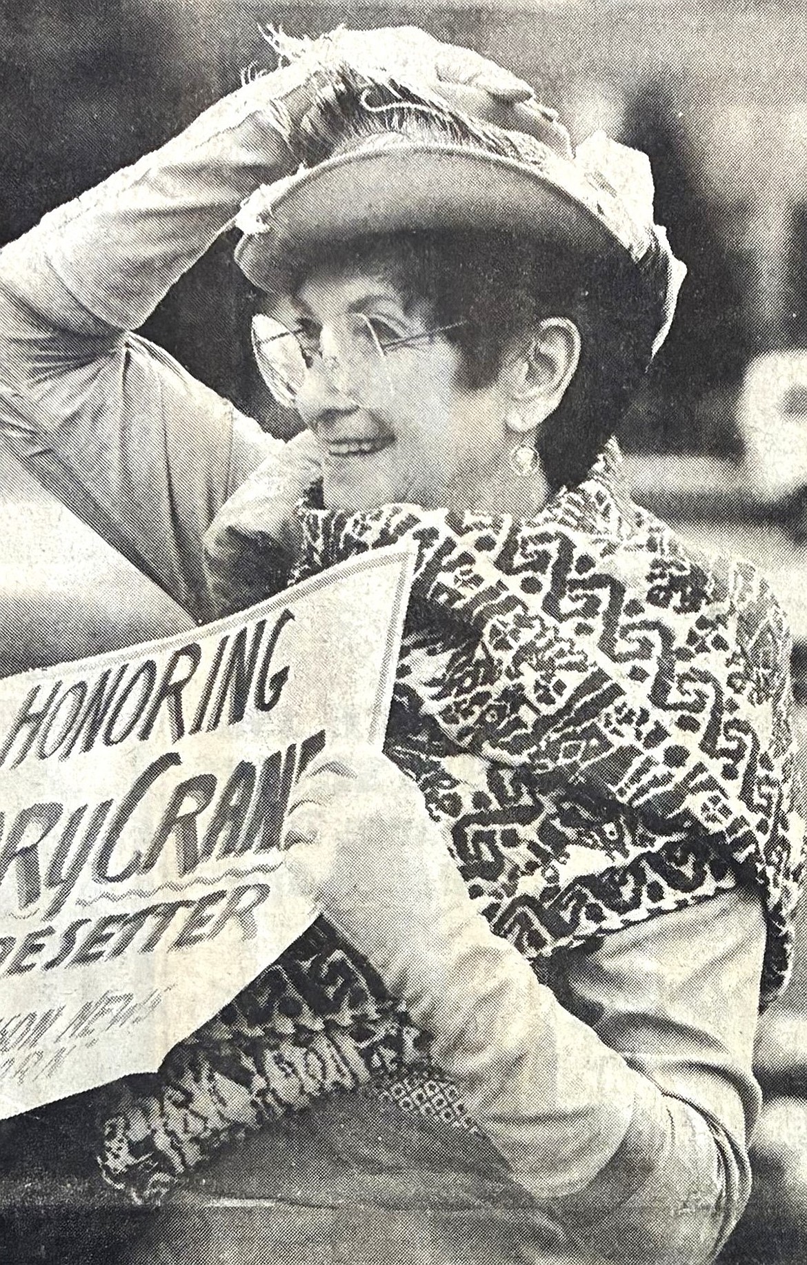 Marie Russell of Harrison holds onto her hat during the wind-swept 1986 International Women’s Day parade on Sherman Avenue.
