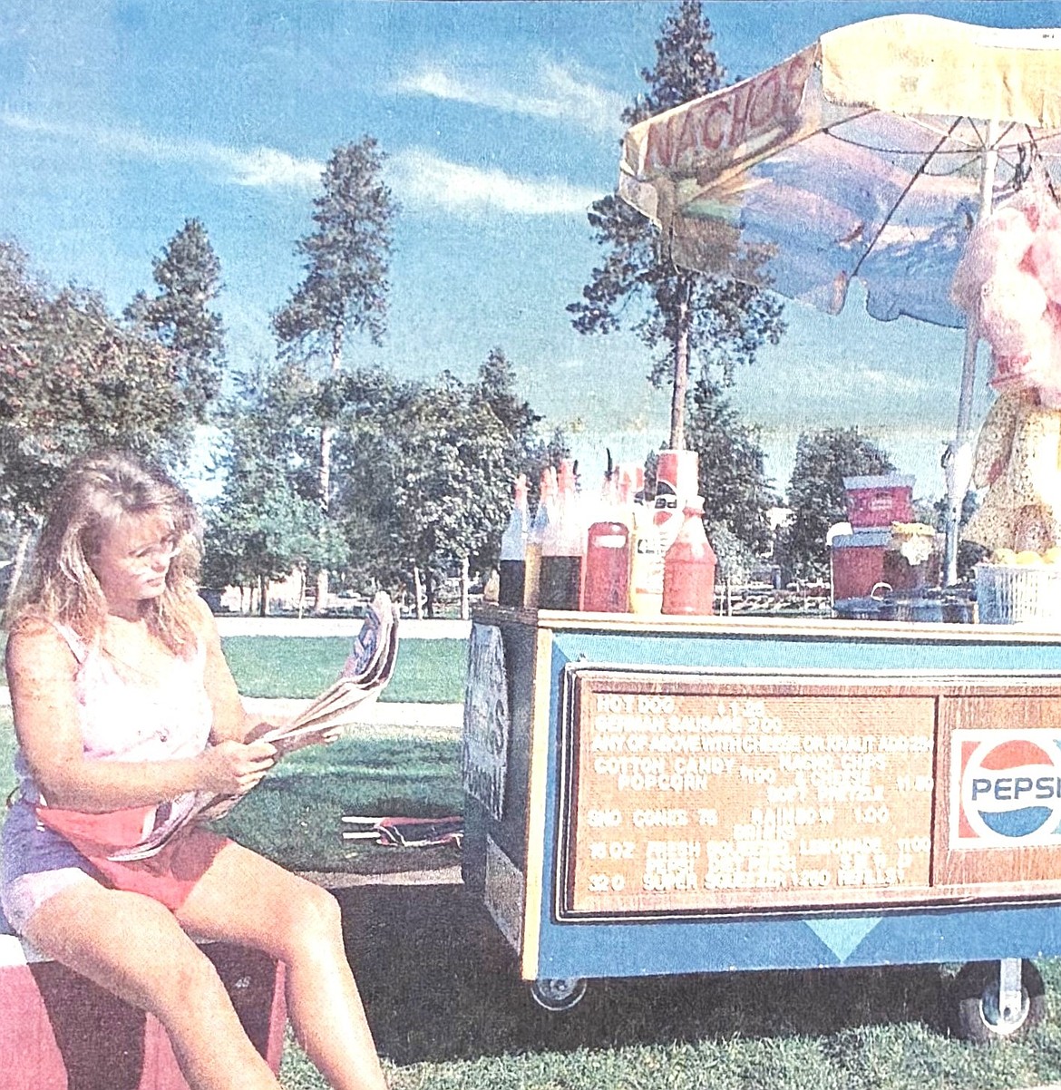 Michele Franks waits for a customer in 1990 at the Maverick Enterprises vendor cart at City Park.