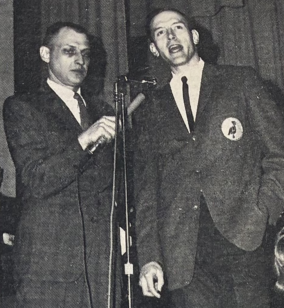Coach Rolly Williams (right) and emcee Bob Angel speak at the 1966 “Rolly Williams Night."
