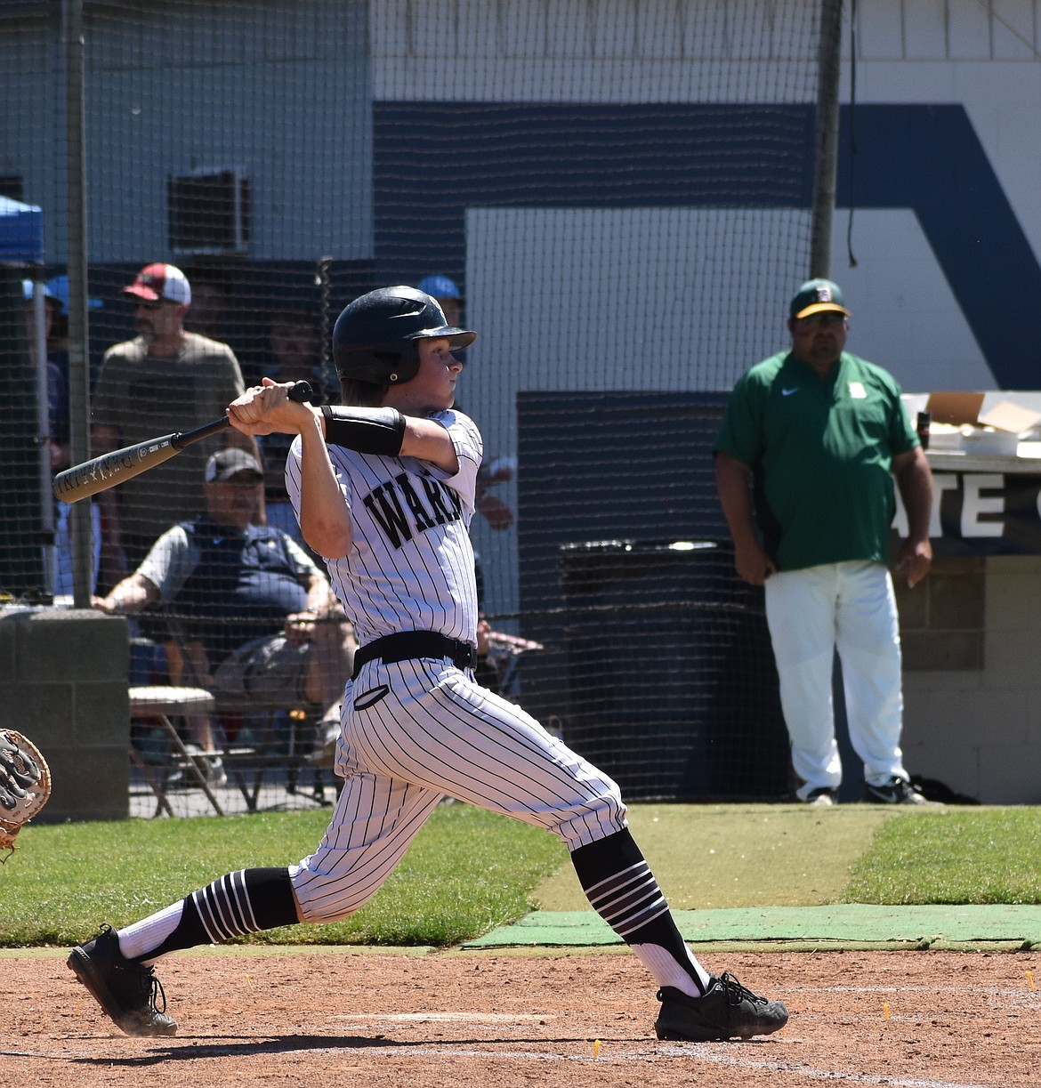 Warriors player Josh Booker smashes the ball across the field last season against DeSales in the state tourney. Booker is among the returning seniors.