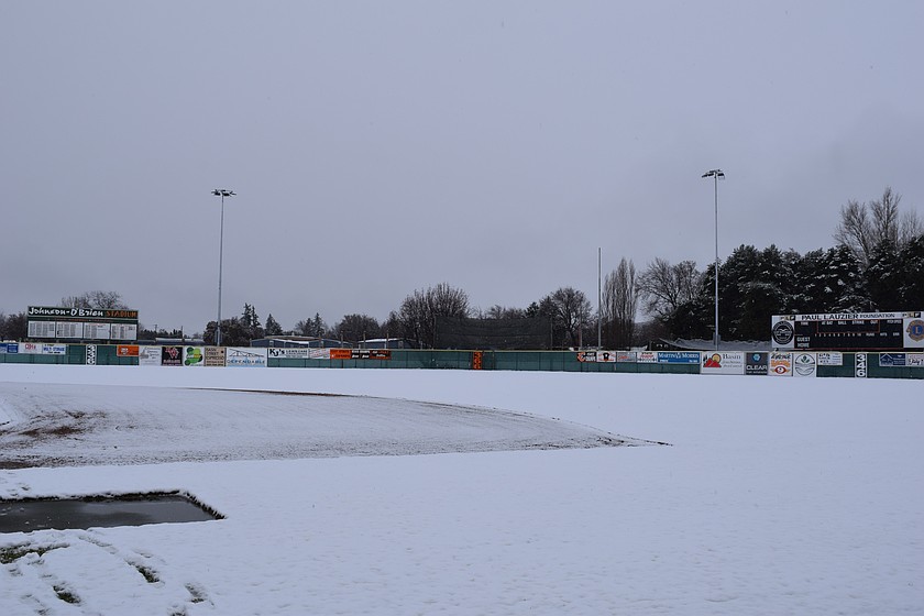 Johnson-O'Brien stadium sits covered in fresh snow Friday morning. Due to snowfall across Washington, sporting events across the Basin have either been delayed or outright canceled this weekend.