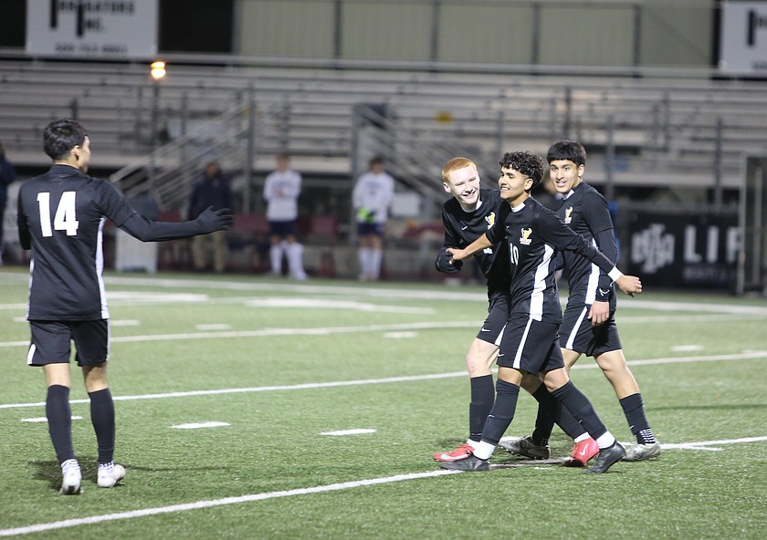 Enrique Landeros (10) is surrounded by his teammates after scoring his second goal against the Ellensburg Bulldogs. The Moses Lake Mavericks defeated Ellensburg 3-0 at home Thursday to start the season 1-0.