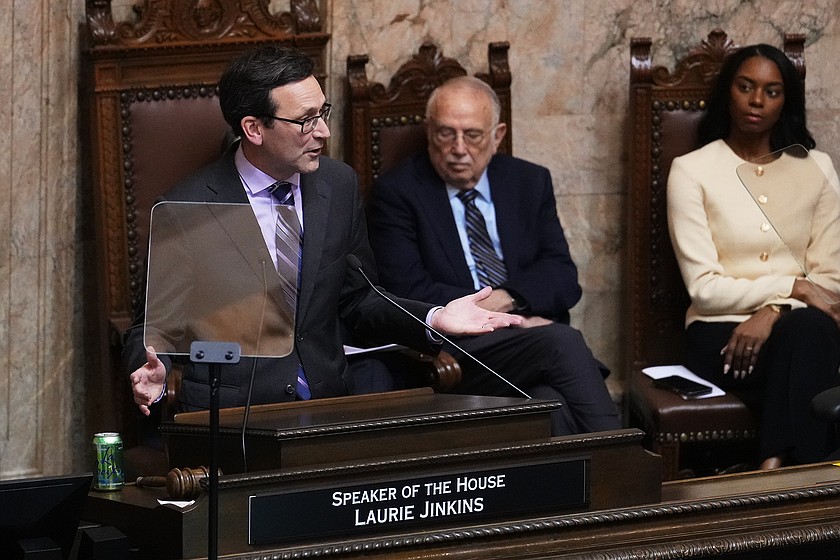 Washington Gov. Bob Ferguson, left, delivers his State of the State address during a joint legislative session at the Washington State Capitol, Tuesday, Jan. 13, 2026, in Olympia, Wash.