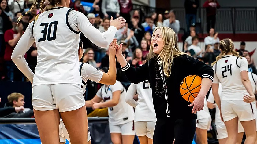 The Wildcats Head Coach Randi Richardson celebrates with her team after advancing to the sweet-16 of the women’s Division 2 tournament.