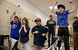 Pinewood Derby cars fly to the finish in Ronan