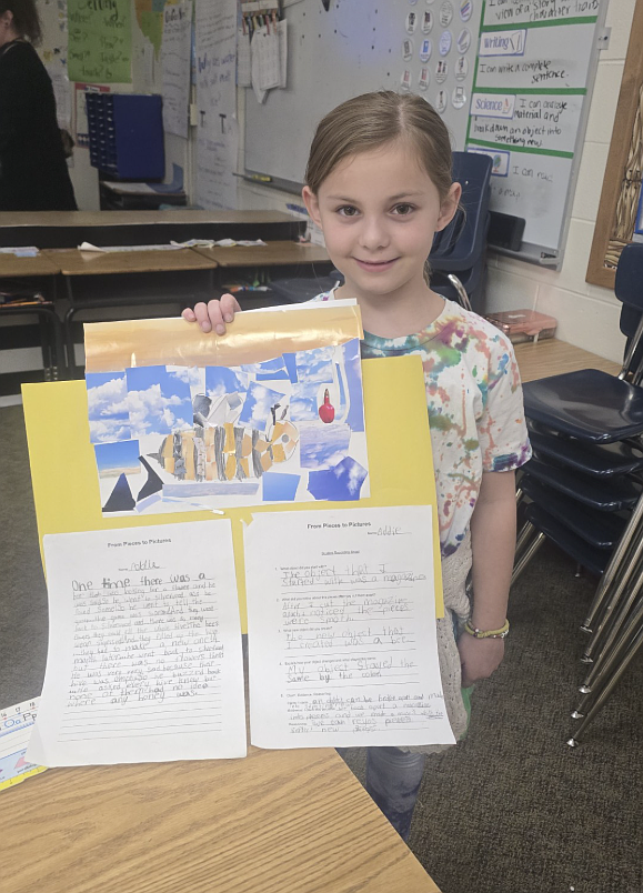 Second grader Adaly Morrow shows off her literacy project, which included a mosaic, during a literacy and science night March 5 at Ramsey.