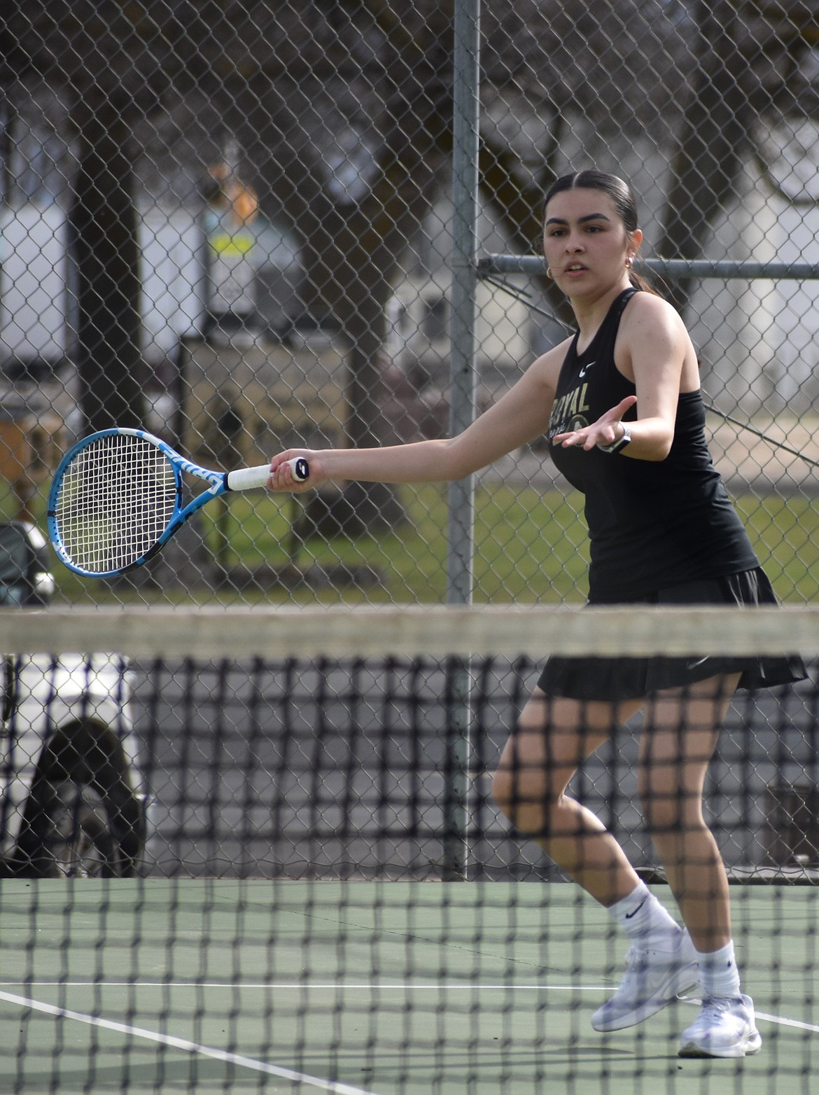 Tania Verzuzco from Royal prepares to send the ball back over the net to the opposing Naches Valley doubles team.