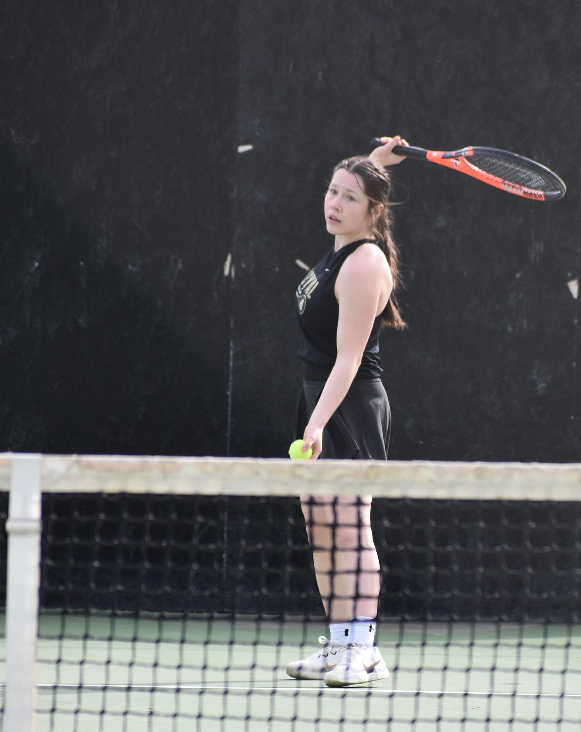 Knights doubles player Heaven Parker gets ready to serve the ball during the Monday afternoon matchup against Naches Valley.