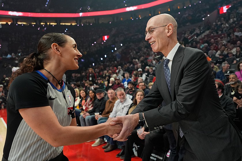 NBA commissioner Adam Silver greets NBA referee Ashley Moyer-Gleich as he arrives for an NBA basketball game between the Portland Trail Blazers and the Utah Jazz, Friday, March 13, 2026, in Portland, Ore.