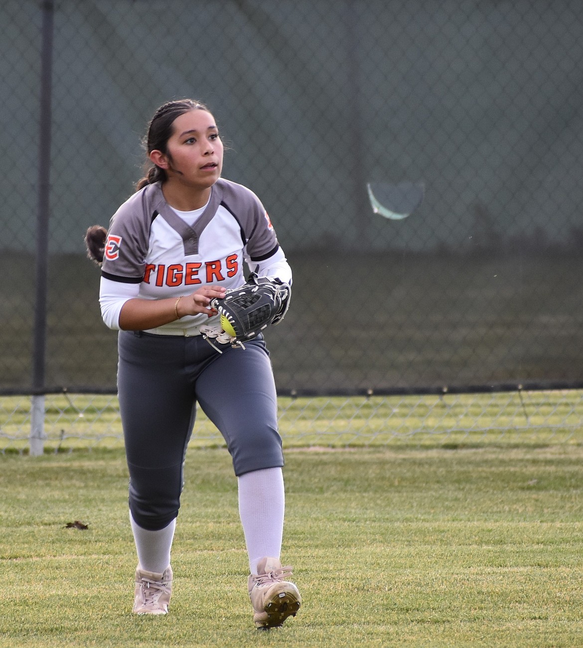 Tiger’s player Cami Martinez makes a catch in centerfield for Wenatchee’s third out at the top of the fifth inning Tuesday afternoon.