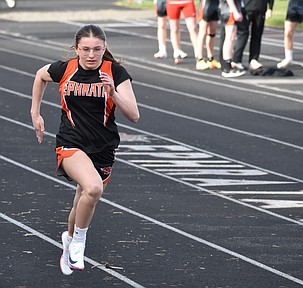 Addison Vasquez from Ephrata races along the track during one of the running events at the Ephrata Ice Breaker Tuesday afternoon.