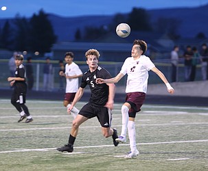 Anderson Brown (5) and Rafael Rodriguez (12) pursue the ball during their game Tuesday. The Royal Knights defeated the Wahluke Warriors 2-0.