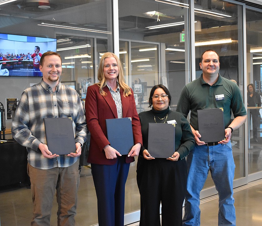 Cade Levine, Melissa Heaps, Michell Valdivia and Justin Henley stand together after being awarded tenure at the March 19 Big Bend Community College Board of Trustees meeting.
