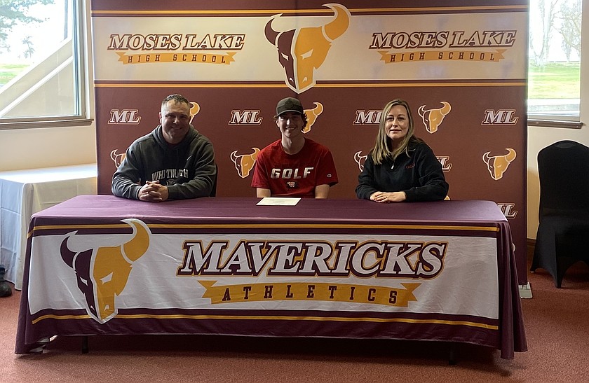 Mason Bradford, in red, sits between his parents before signing his letter of intent to play golf at Whitworth University.