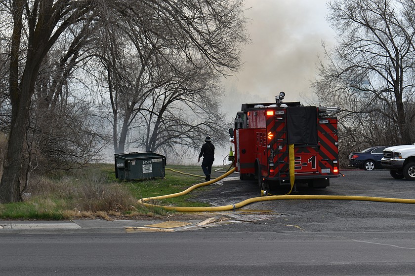 A fire burned a section of the shore of the wetland that borders the Japanese Peace Garden in Moses Lake Friday morning.