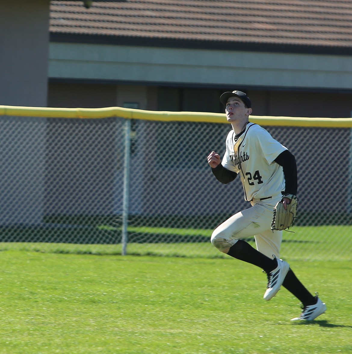 The Knights’ Bryan Larsen keeps his eye on a fly ball during their game against Zillah Saturday.