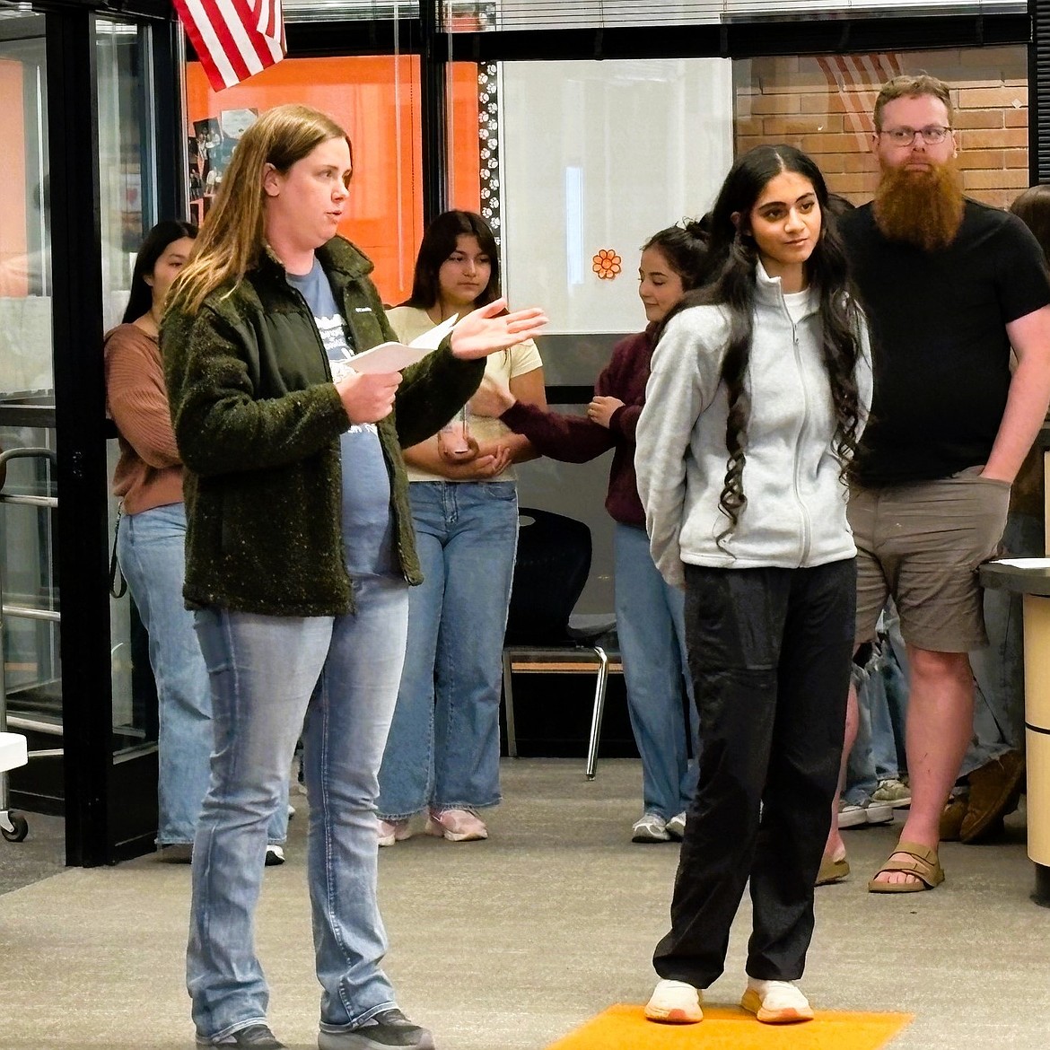 Health Occupations Students of America coach Marissa Cox stands with Navi Kaur as Cox shares the team’s success in the state conference. Kaur advanced to the second round in the Family Medicine Physician event.
