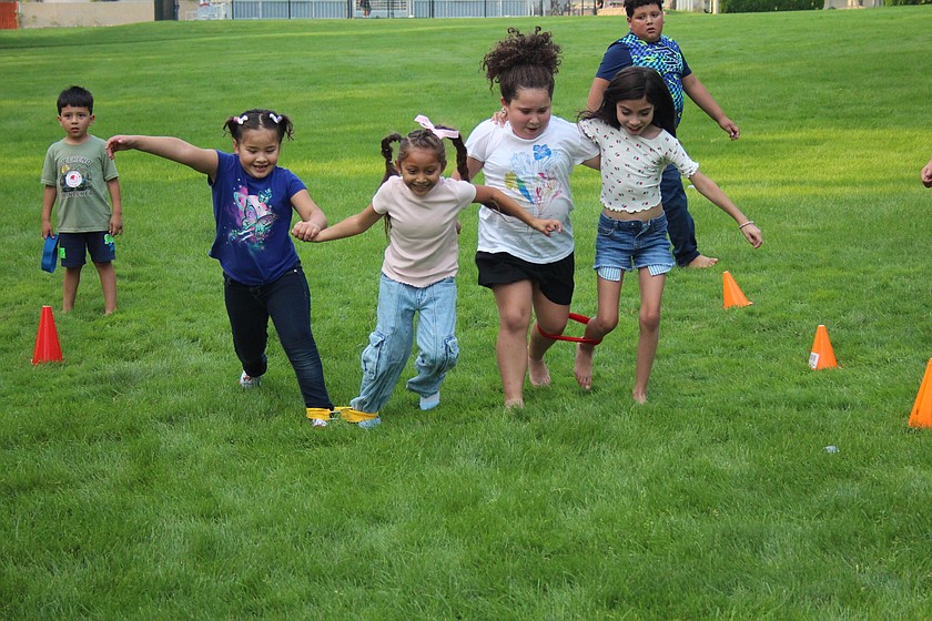 Children play in Othello’s Kiwanis Park during an August 2025 event. The park will be getting a new playground and a bigger parking lot, possibly by summer 2027.