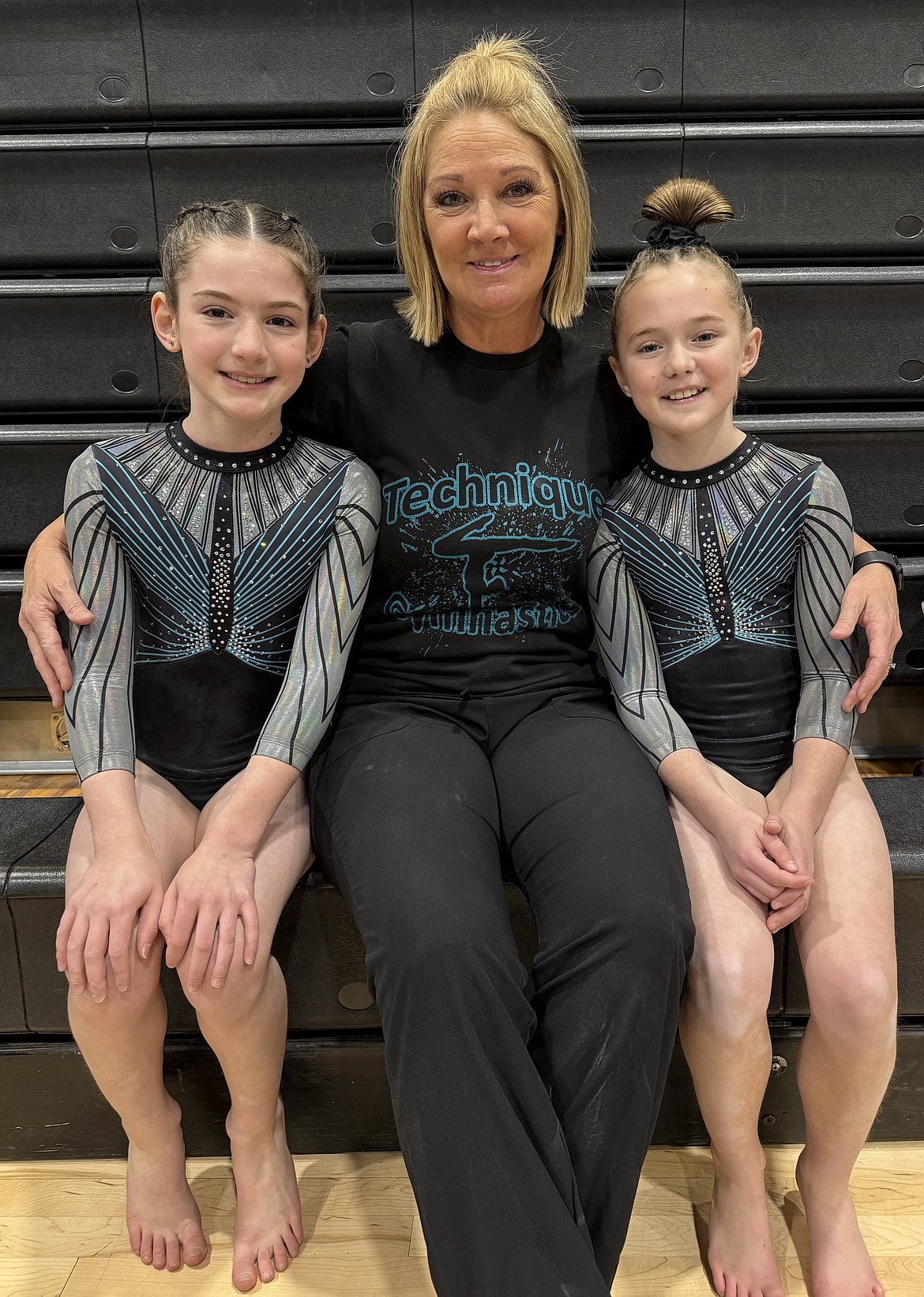 Courtesy photo
Technique Gymnastics Level 5s attended the Idaho Devo State Championship in Kuna. From left are Apollonia Bell, coach Suni Crawford and Mackenzie Brockett.  Apollonia is the State Champion on vault and in the All-Around with scores of 9.65 and 37.25, she is the Silver Medalist on bars with a 9.075, she is also the Bronze Medalist on beam and floor with scores of 9.2 and 9.35; Mackenzie is the Silver Medalist on vault with a 9.55, she is the Bronze All-Around Medalist with a 36.375, she was also 5th on bars and beam with scores of 8.775 and 9.05, and 7th on floor 9.0.