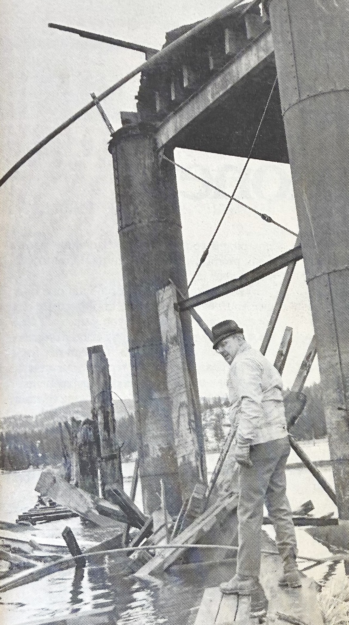 Sheriff’s Deputy Joe Daley surveys debris from the collapse of the Spokane Street bridge in 1971.
