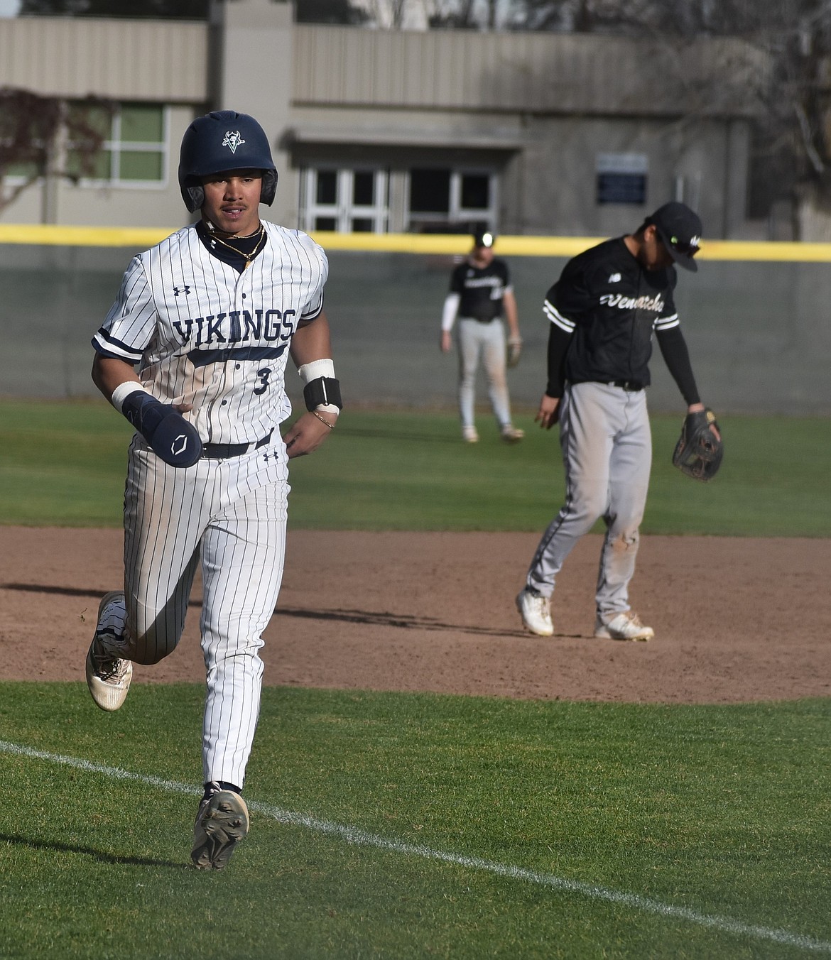 Kaiden Weakley from Big Bend heads for home plate against Wenatchee Valley.
