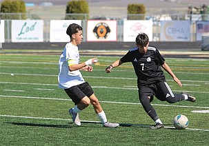 Elmer Gonzalez (7) from the Knights moves the ball up the field against Connell. The Knights remain at home this week playing both Tuesday and Friday at 6 p.m.