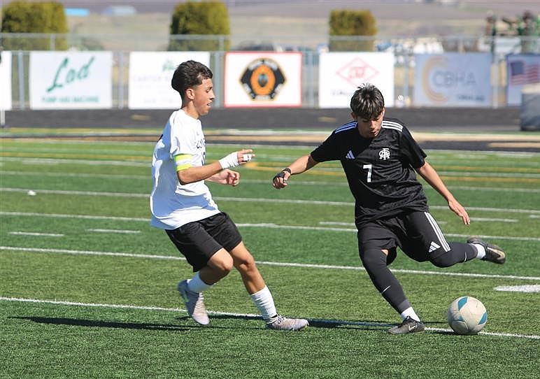 Elmer Gonzalez (7) from the Knights moves the ball up the field against Connell. The Knights remain at home this week playing both Tuesday and Friday at 6 p.m.