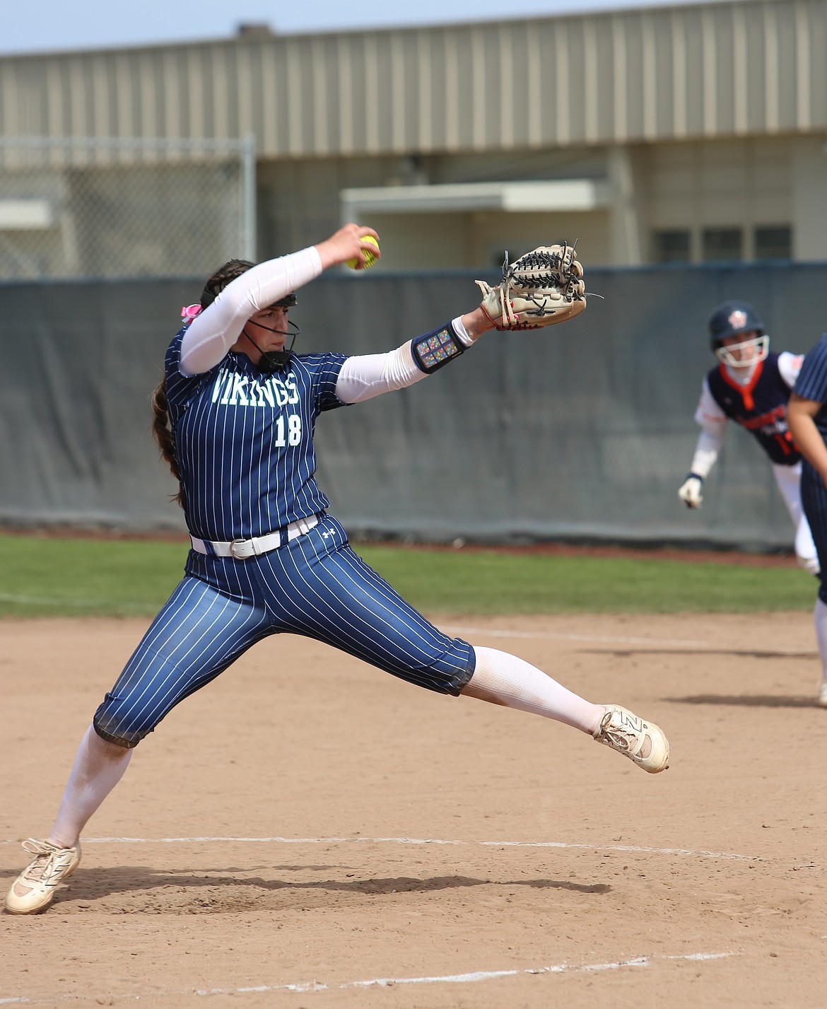 Dakota Brown (18) throws against Treasure Valley Saturday. Brown pitched all of game one and two innings of game two for the Big Bend Lady Vikings.