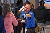 Some wait times at airport bottlenecks are easing with TSA paychecks promised