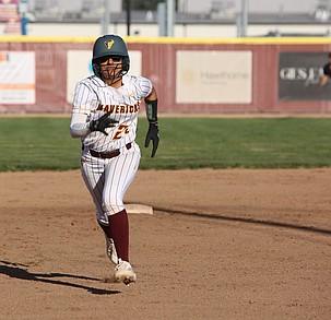 Mya Martinez (22) from the Moses Lake Mavericks sprints toward third base against Sunnyside Friday.
