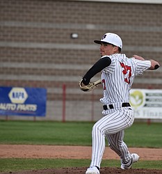 Aiden Garza from the Huskies hurls a pitch to a Prosser batter during Tuesday’s game. Garza threw for three innings where he struck out six batters.