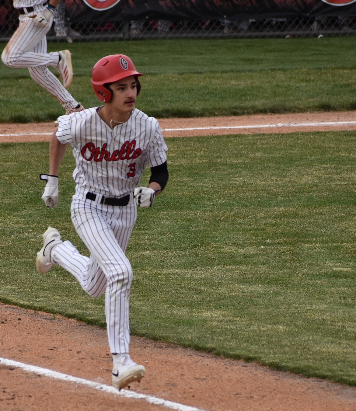 Huskies player Tyler Suarez sprints toward first base after making a hit against Prosser.