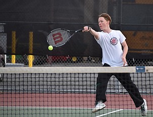 Max Harris from the Huskies responds to a hit from his opponent, Avery Morris from the Tigers during a close matchup Tuesday afternoon. Max said he was nervous moving in from his usual doubles position to the number one singles position, but overcame his nerves to find success on the court.
