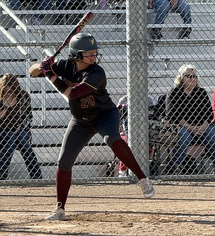 The Mavericks’ Alina Lopez (20) steps into her swing while at bat. Moses Lake defeated Eisenhower 19-0 and 25-5 in a doubleheader Friday.