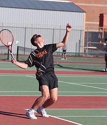 The Ephrata Tigers’ Mitch Morford, in black, serves the ball over the net against Quincy earlier this season.