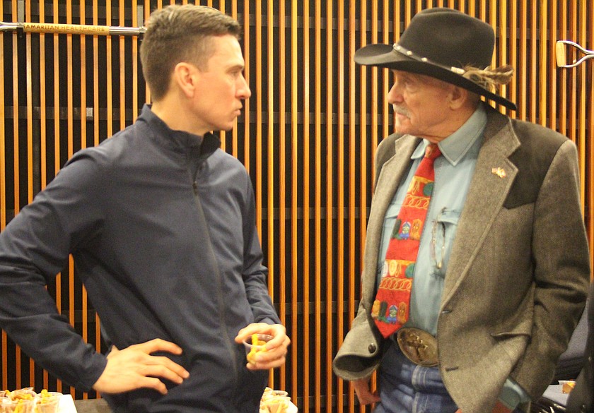 Rep. Tom Dent, right, talks with Moses Lake City Council member Joel Graves at a December meeting. Dent announced Sunday he is running for reelection.