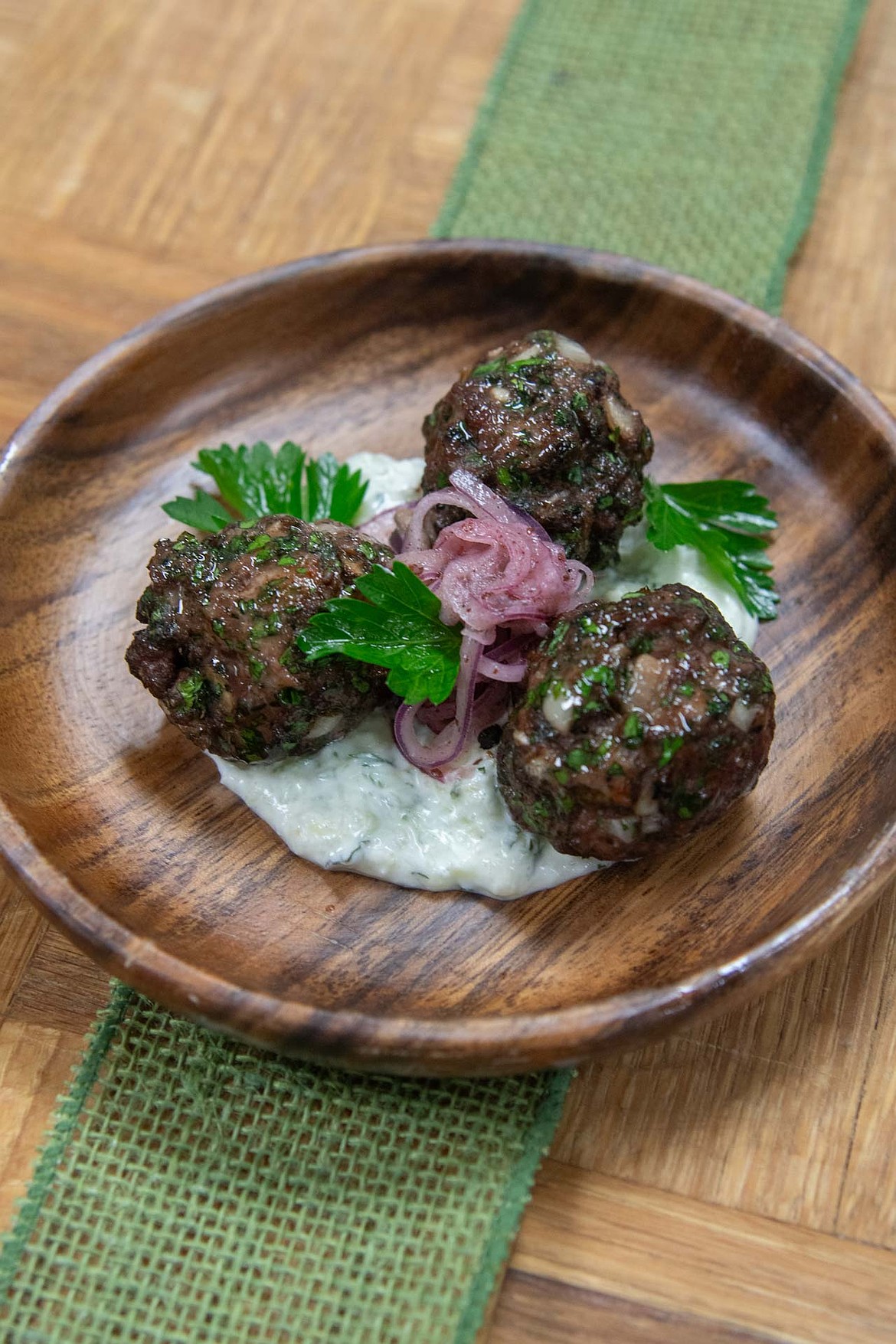 The Kofta is herbaceous lamb and beef Lebanese meatballs served with tzatziki and sumac onions. (Courtesy photo)