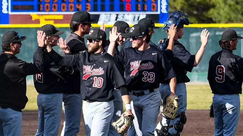 The Wildcats give each other high fives on the field following the success in Saturday’s games against MSUB.