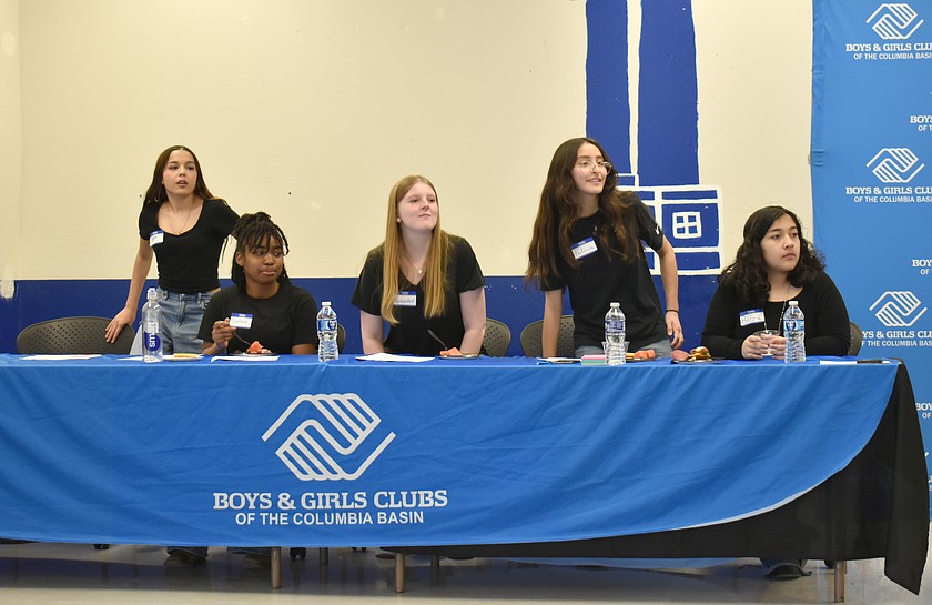 From left: Sophia Gonzalez, Selina Bailey, Kenadee Browning, Felicia Rodriguez and Briza Hernandez take their seats in preparation for the “Think, Learn, Create Change” town hall Wednesday, facilitated by the Boys & Girls Clubs of the Columbia Basin.