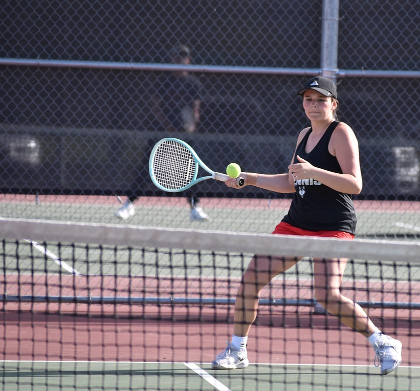 Hazel Roylance from the Huskies prepares to return the ball during Wednesday’s second doubles match against Toppenish.