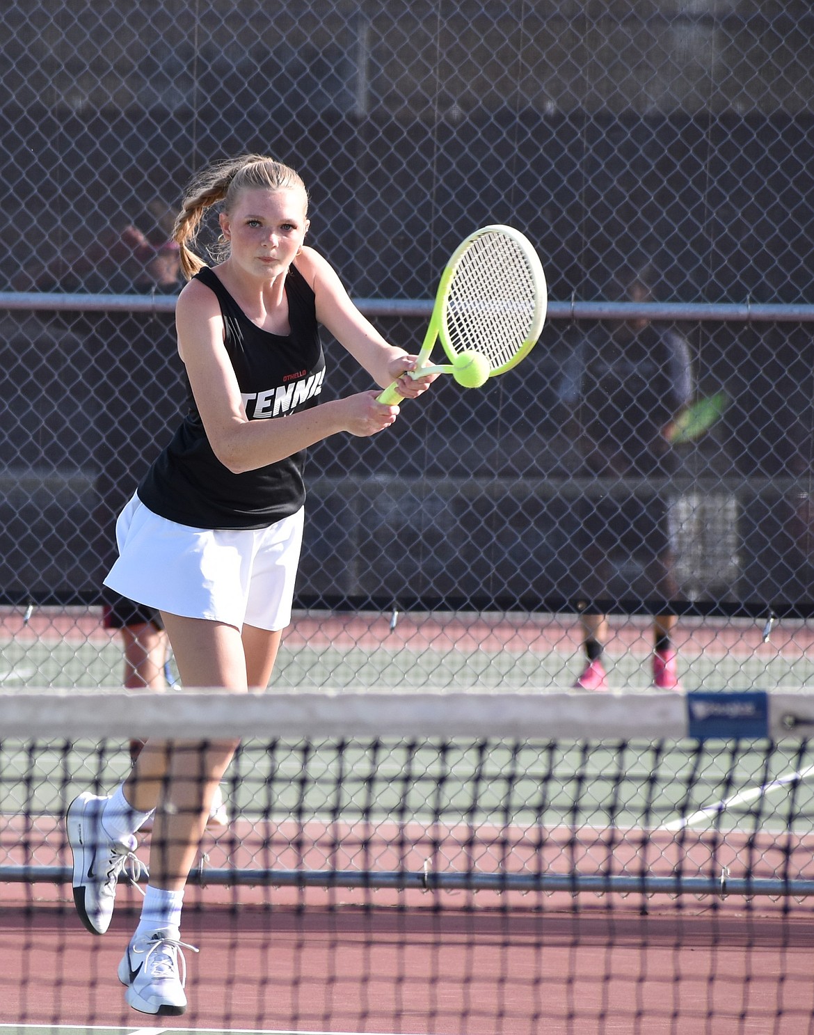 Huskies player Shaylee Freeman hits the ball back to the opposing Toppenish first doubles team Wednesday.