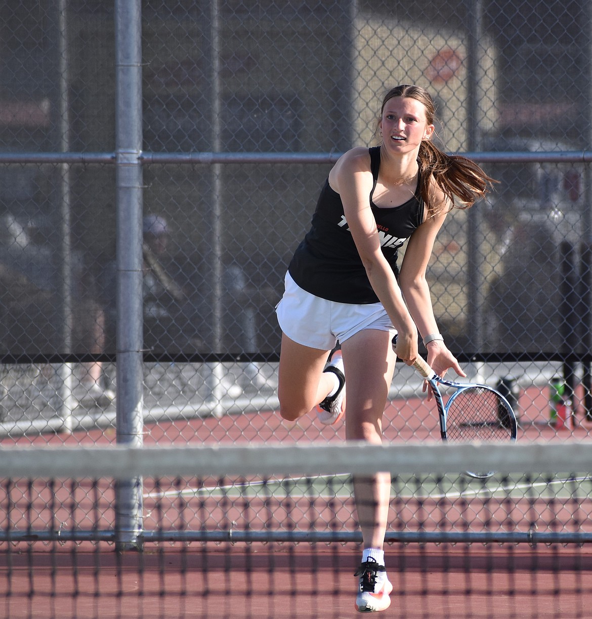 Faith Risenmay from Othello smacks the ball over the net to Toppenish during the first doubles match Wednesday afternoon.