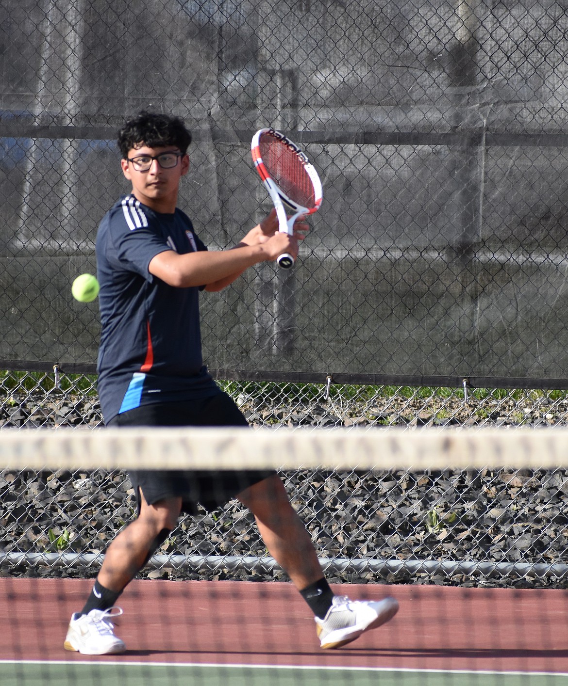 George Arevalo from Othello prepares to respond to a Toppenish serve in the first singles match Wednesday.