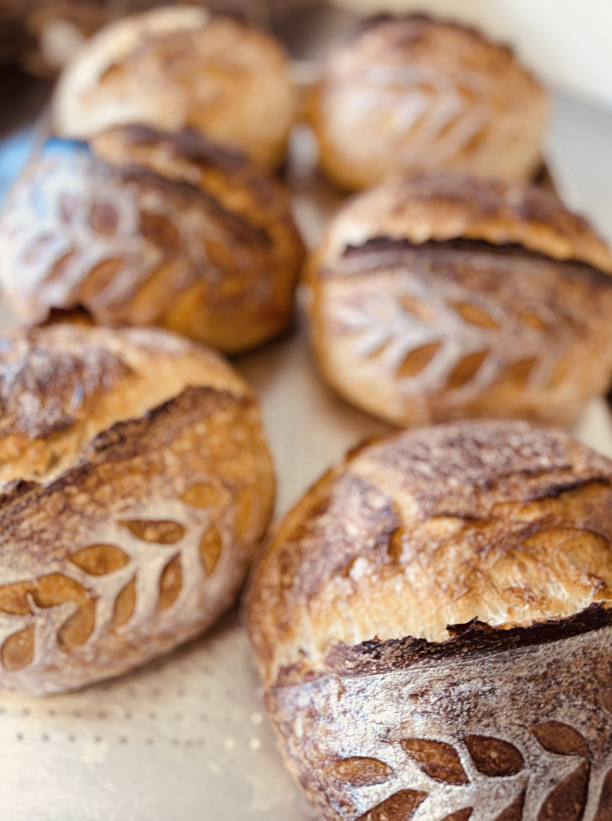 Artisan sourdough loaves crafted by Lyndsey Neufeld of Dat Bread Dough are highly sought after by farmers' market patrons. "It genuinely warms my heart to see people smile, do a little happy dance and start talking with each other about what they are going to make with their bread," Neufeld said. "I truly have the best customers anyone could ask for. That sense of community is what keeps me going."