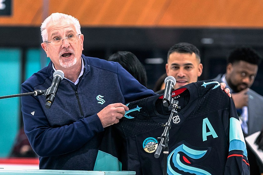 FILE - Tod Leiweke, Seattle Kraken CEO, shows off the new Kraken jersey with the Muckleshoot Indian Tribe patch on Feb. 22, 2023, at the Kraken Community Iceplex in Seattle.