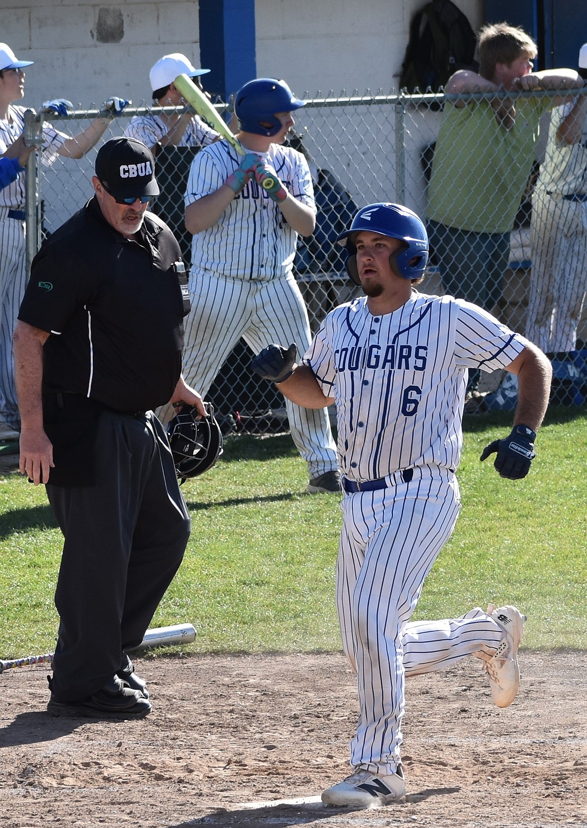 Warden’s Rhett Jorgensen crosses home plate to score a run against Lake Roosevelt Thursday afternoon.