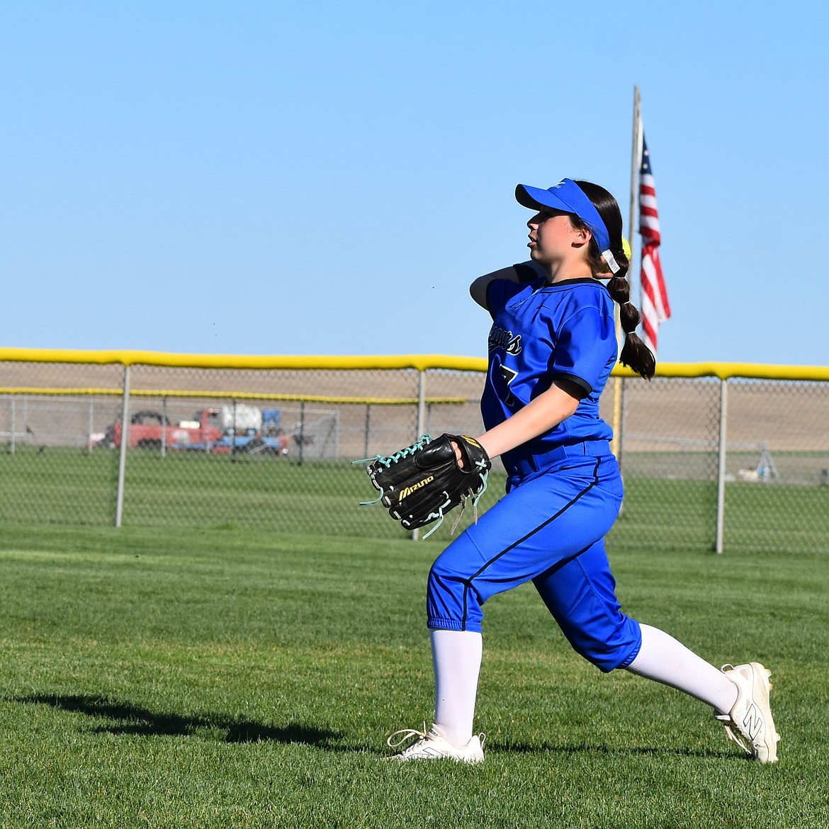 Cougars player Addison Garza throws the ball back toward the diamond from the outfield during Thursday afternoon’s game against Lake Roosevelt.