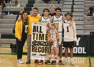 Pierce Bierlink, holding the poster, stands with his family after setting the all-time scoring record in Jacks program history. Bierlink recently committed to the Whitworth Pirates basketball program.