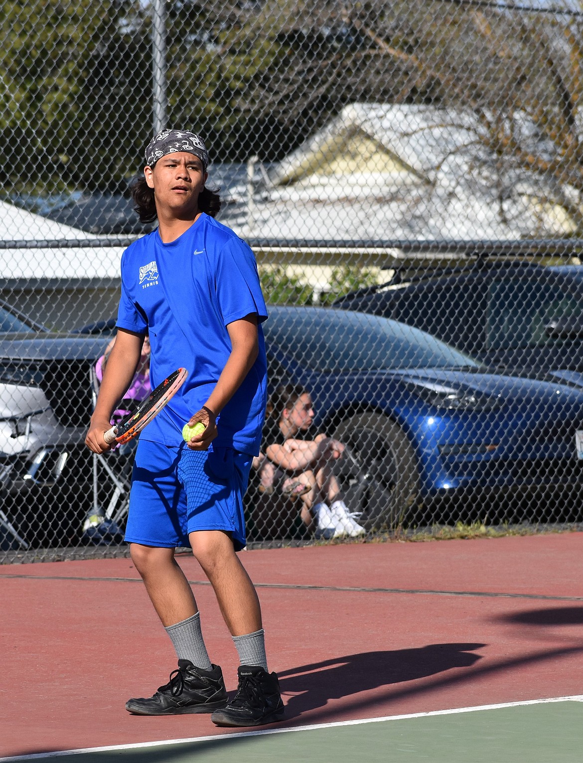 Jonathan Knapp from Soap Lake prepares to serve the ball during the boys first doubles match against Entiat.