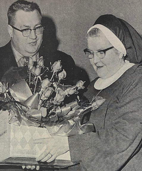 In 1971, John Rieger of Wallace presents roses to Sister Ida, principal of the Immaculate Heart of Mary, on behalf of the Principals’ Association.